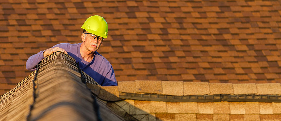Home inspector inspects roof